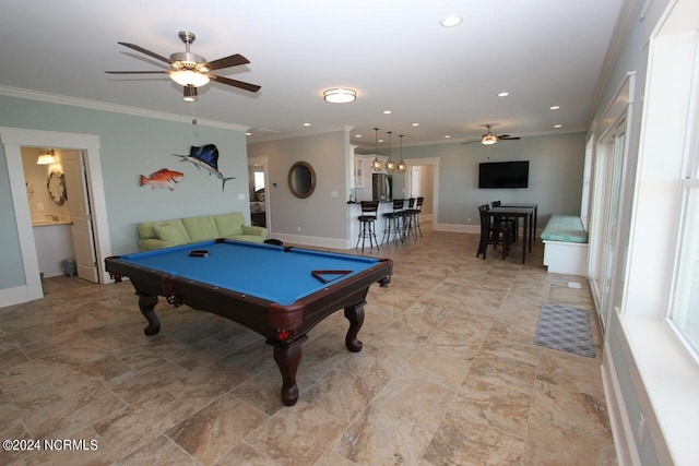 playroom with ceiling fan with notable chandelier, pool table, and ornamental molding