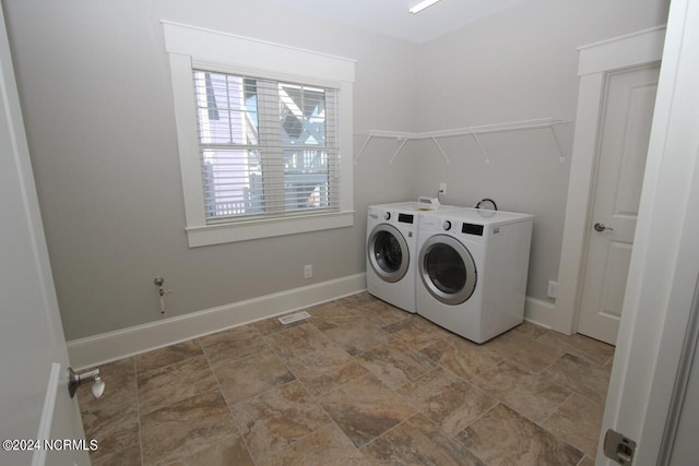 washroom featuring washer and clothes dryer