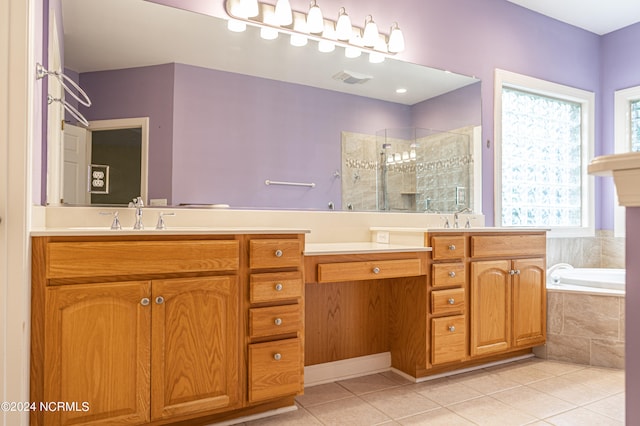 bathroom featuring tile patterned flooring, vanity, and separate shower and tub