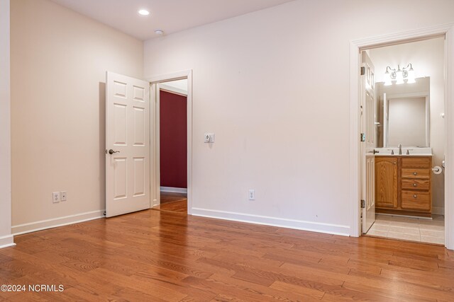 interior space with sink and light hardwood / wood-style flooring