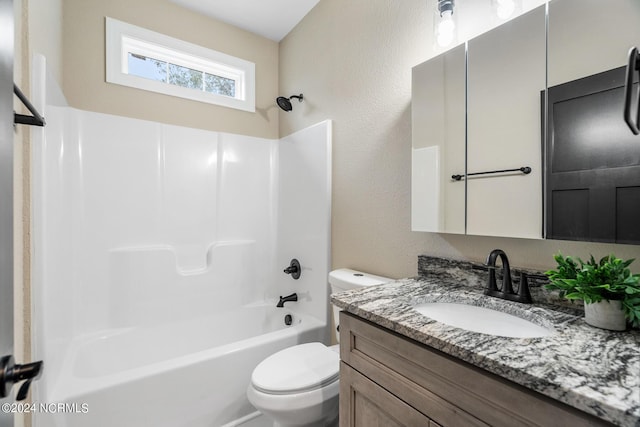 full bath featuring toilet, a textured wall, bathtub / shower combination, and vanity