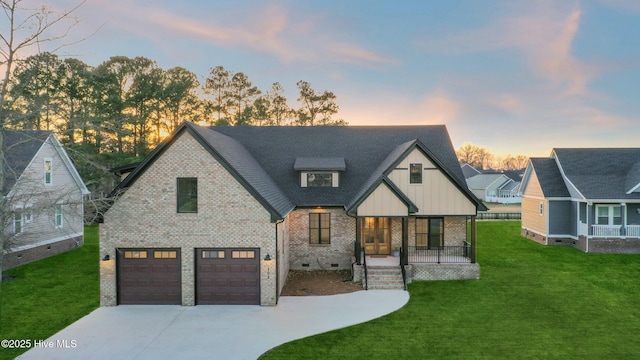 modern inspired farmhouse featuring covered porch, brick siding, driveway, crawl space, and a front lawn