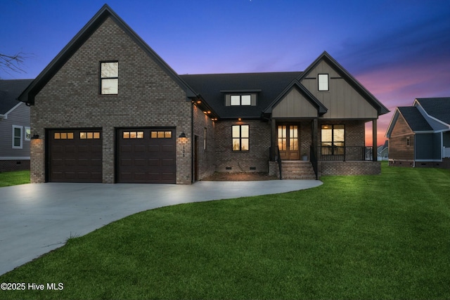 modern farmhouse style home with brick siding, covered porch, crawl space, driveway, and a front lawn