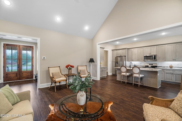 living area featuring high vaulted ceiling, recessed lighting, baseboards, french doors, and dark wood-style floors