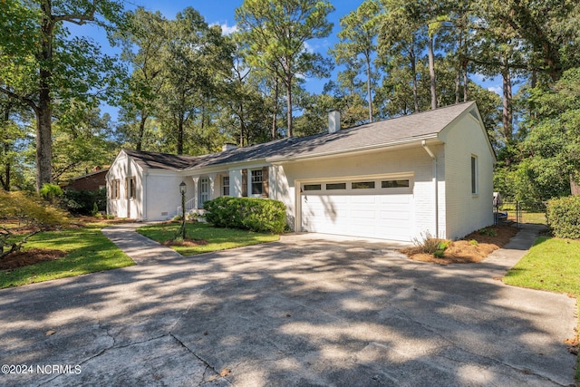 ranch-style home with a garage