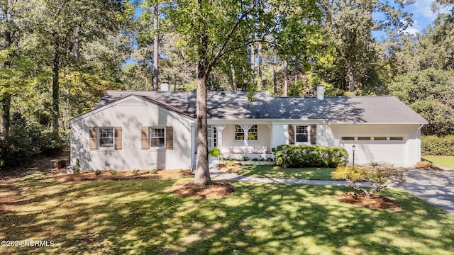 single story home with a front lawn and a garage