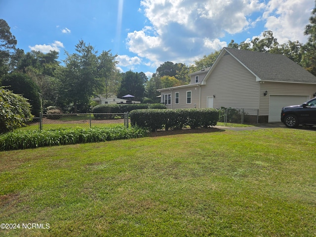 view of yard with a garage