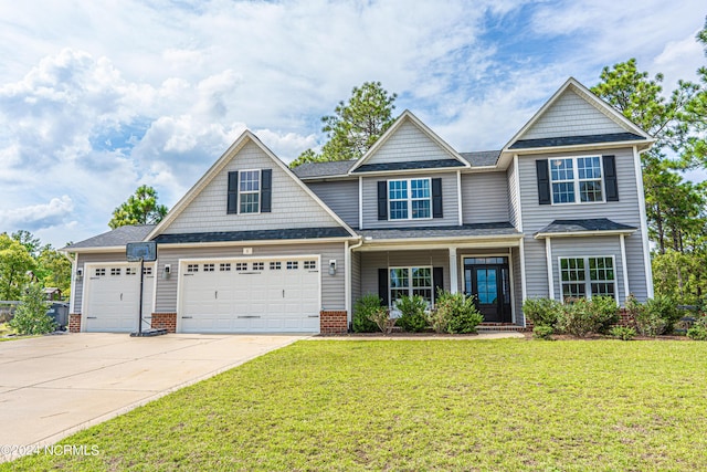6 Eagle Dr, Foxfire Village, NC 27281 - craftsman-style home with concrete driveway, a front yard, brick siding, and a garage