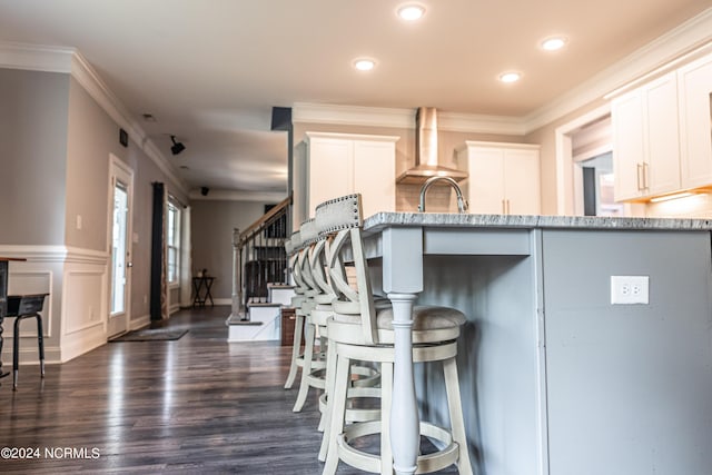 6 Eagle Dr, Foxfire Village, NC 27281 - kitchen featuring light stone countertops, dark wood-style flooring, white cabinetry, and ornamental molding