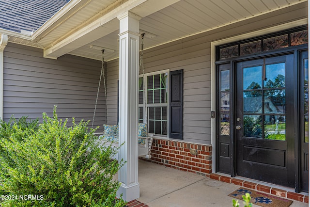 entrance to property with a porch