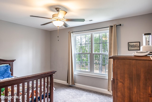 carpeted bedroom with ceiling fan