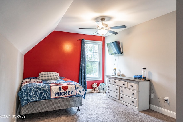 bedroom with ceiling fan, lofted ceiling, and carpet