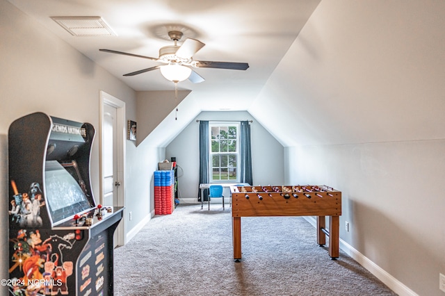 playroom with carpet floors, vaulted ceiling, and ceiling fan