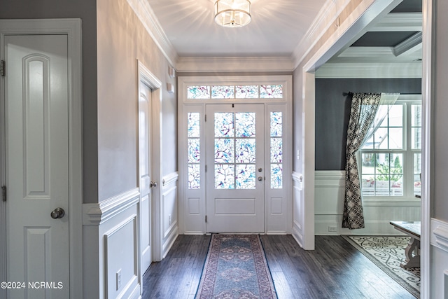 entrance foyer featuring ornamental molding and dark wood-type flooring