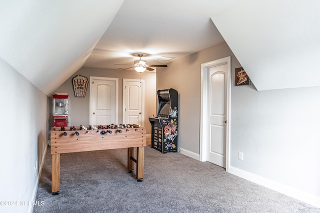 playroom featuring lofted ceiling, ceiling fan, and carpet floors