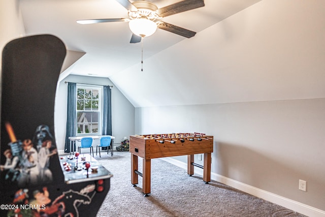 recreation room featuring light carpet, lofted ceiling, and ceiling fan