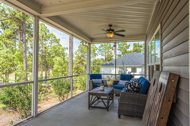 sunroom / solarium featuring ceiling fan