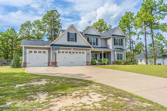 craftsman-style house with a front yard and a garage