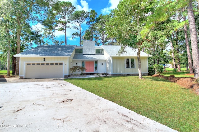 ranch-style home featuring a front yard and a garage