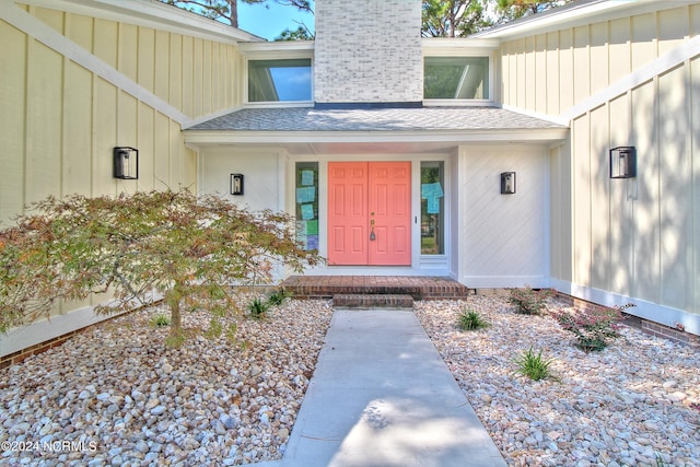 view of exterior entry with covered porch