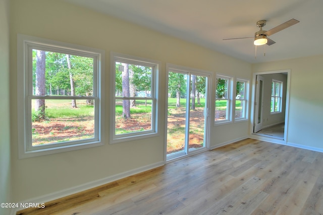 interior space featuring a wealth of natural light, ceiling fan, and light wood-type flooring