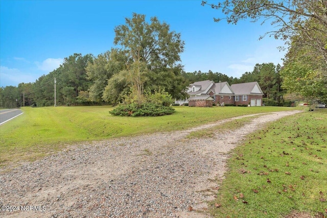 exterior space featuring a front lawn