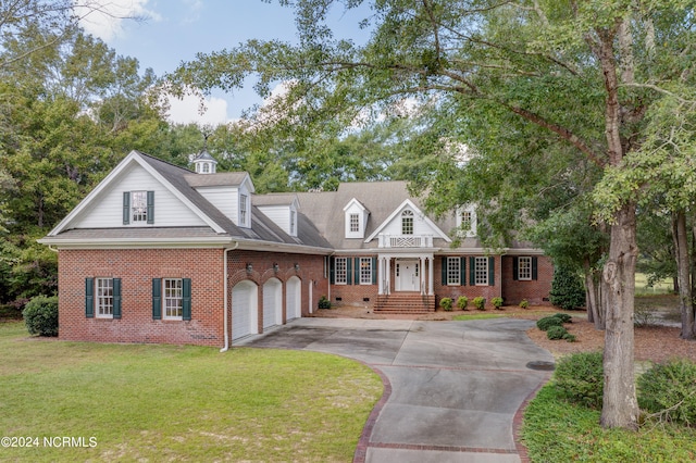 cape cod-style house with a front yard and a garage