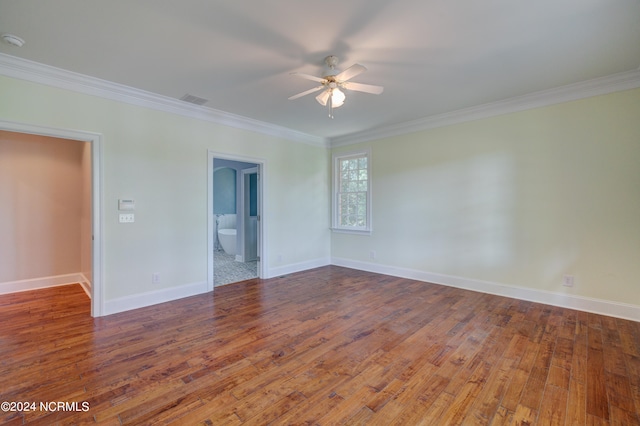 empty room with crown molding, hardwood / wood-style floors, and ceiling fan