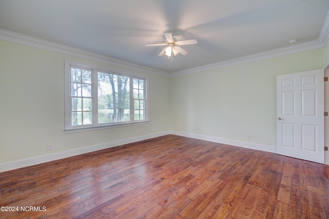 empty room featuring crown molding, hardwood / wood-style floors, and ceiling fan