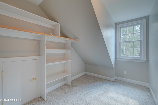 bonus room featuring vaulted ceiling