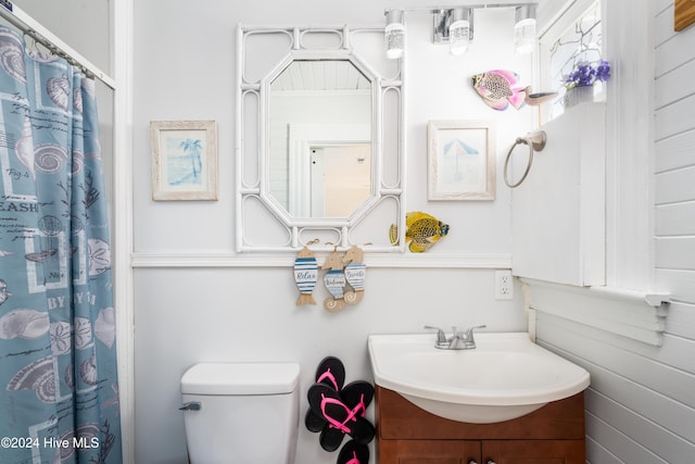 3016 W Beach Dr, Oak Island, NC 28465 - bathroom featuring toilet, vanity, and a shower with curtain