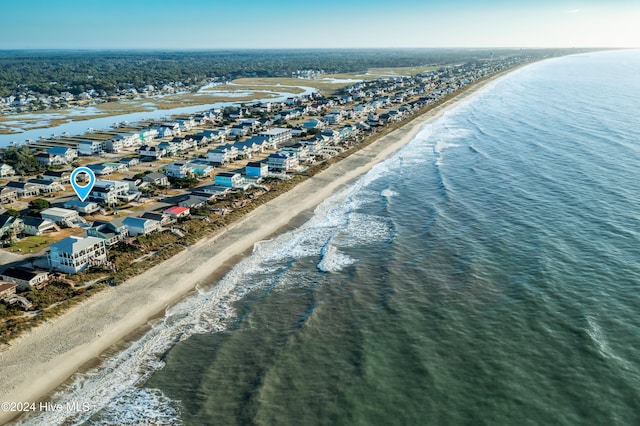 bird's eye view featuring a view of the beach and a water view