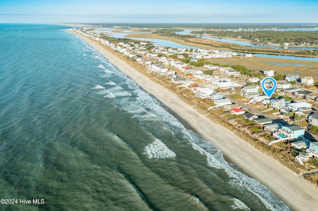 drone / aerial view with a view of the beach and a water view