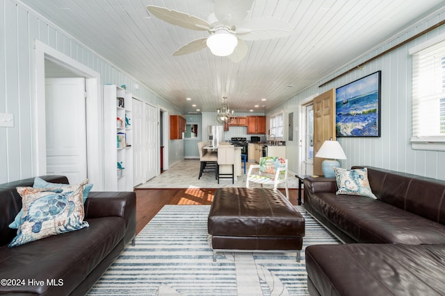 3016 W Beach Dr, Oak Island, NC 28465 - living area featuring light wood-type flooring, ceiling fan, a chandelier, and wood ceiling
