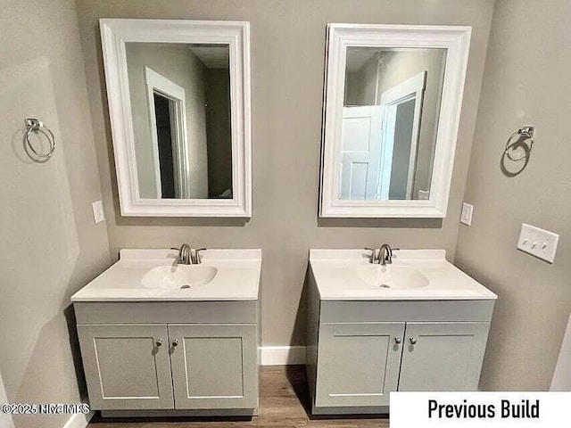 bathroom featuring vanity and wood-type flooring