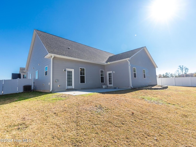 back of house featuring a patio area, a yard, and cooling unit