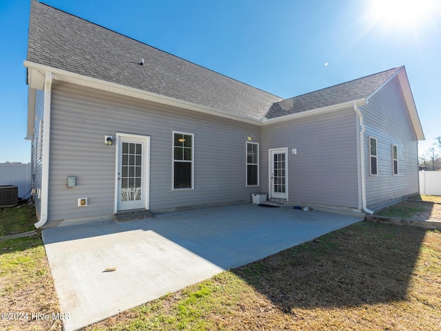 back of house with cooling unit and a patio area