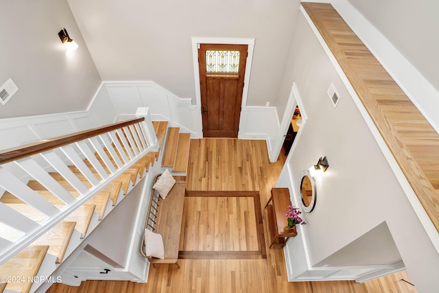 stairs featuring hardwood / wood-style flooring