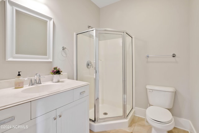 bathroom with vanity, toilet, tile patterned floors, and an enclosed shower