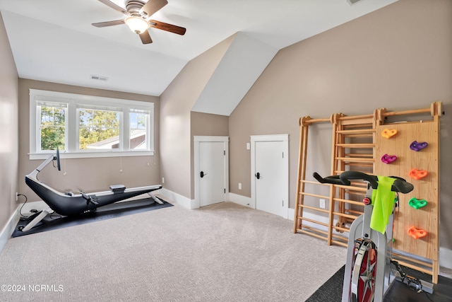 exercise area with ceiling fan, lofted ceiling, and carpet flooring