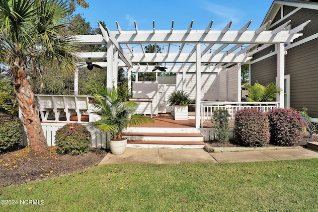 view of patio featuring a wooden deck and a pergola