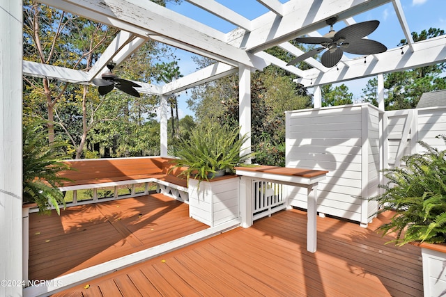 wooden deck featuring a pergola and ceiling fan