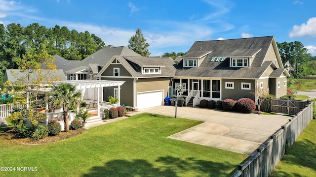 view of front facade featuring a sunroom, a pergola, a front lawn, and a garage