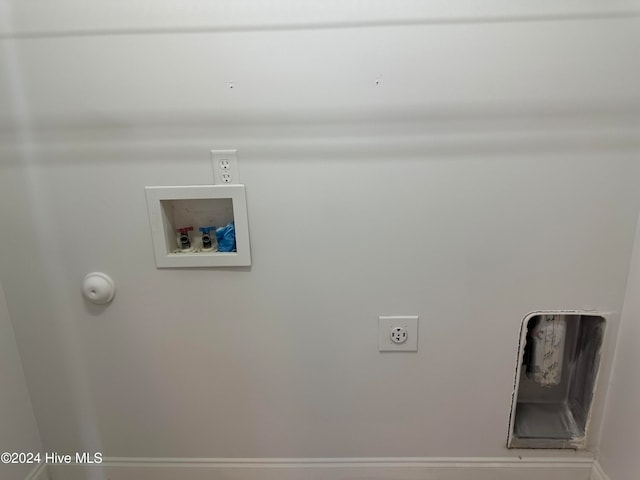 clothes washing area featuring hookup for a washing machine and electric dryer hookup