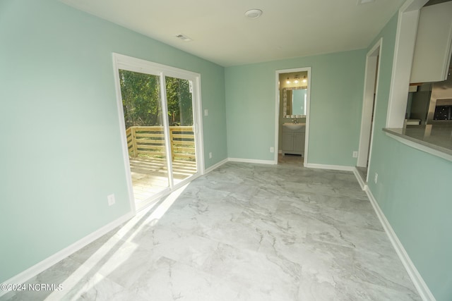 unfurnished room with sink