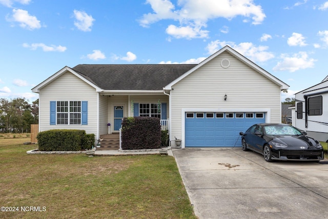 single story home featuring a garage and a front lawn