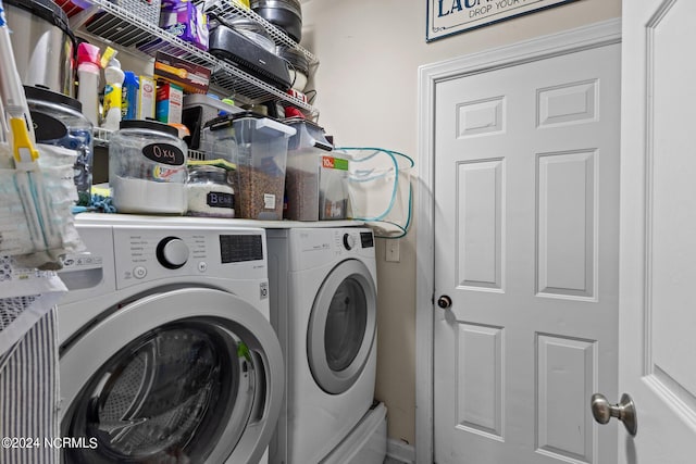 laundry room with independent washer and dryer