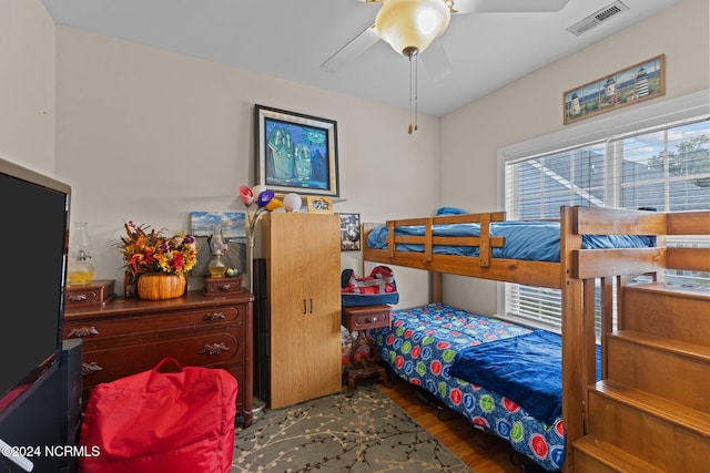 bedroom with ceiling fan and dark hardwood / wood-style floors