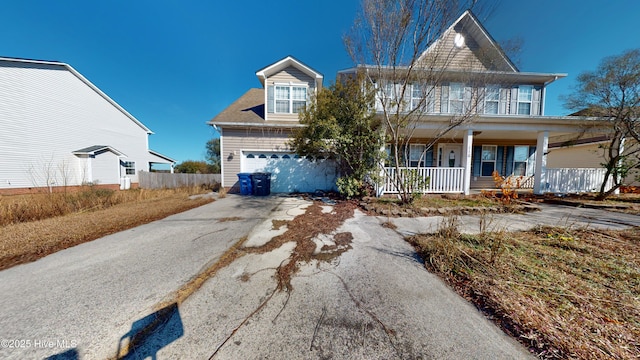 view of front of home with a garage and covered porch