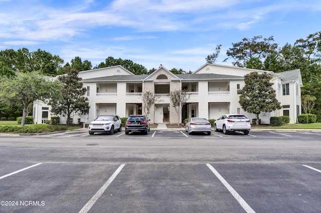 view of property featuring uncovered parking